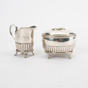 A 20th century silver creamer and sugar bowl weight 310 grams.