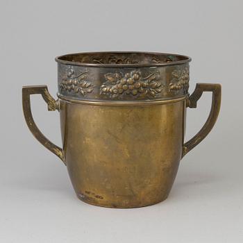 A brass jugend-style champagne cooler from early 21 st century.