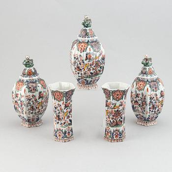 A five piece french faience garniture.