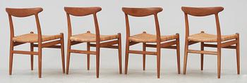 A set of four Hans J Wegner teak and rattan chairs, CM Madsen, Denmark 1950's-60's.