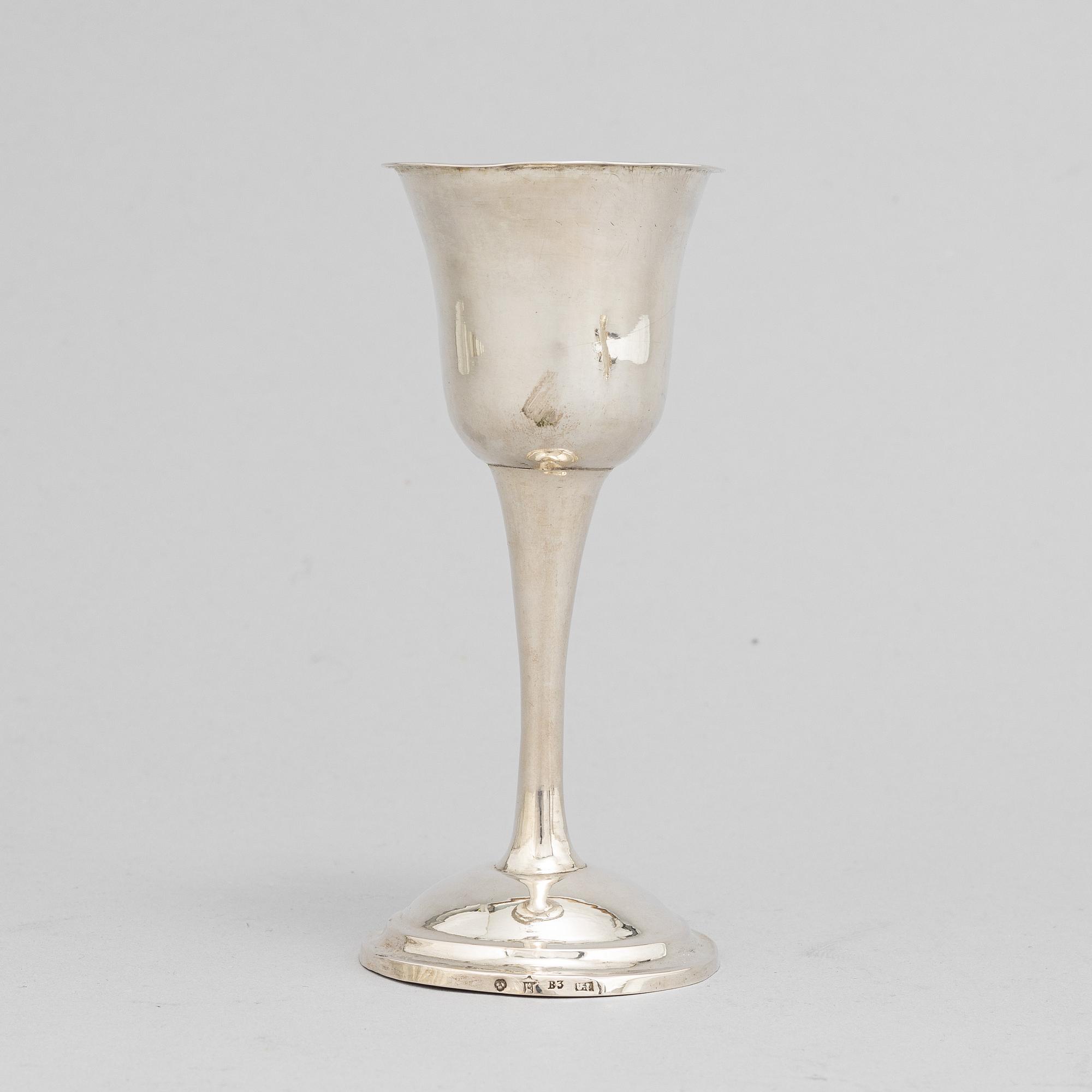 A Swedish 18th / 19th century silver beaker, cup and caster-spoon.
