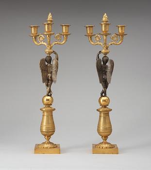 A pair of French Empire early 19th century three-light candelabra.