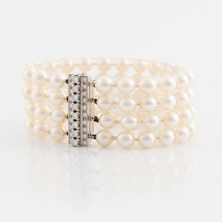 Four strand cultured pearl bracelet, clasp white gold with brilliant cut diamonds.
