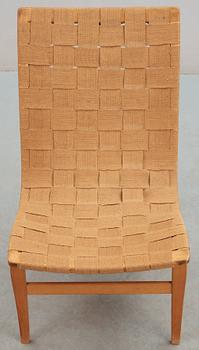 A Bruno Mathsson beech and canvas easy chair, 'Eva', Karl Mathsson, Värnamo, Sweden 1940's.