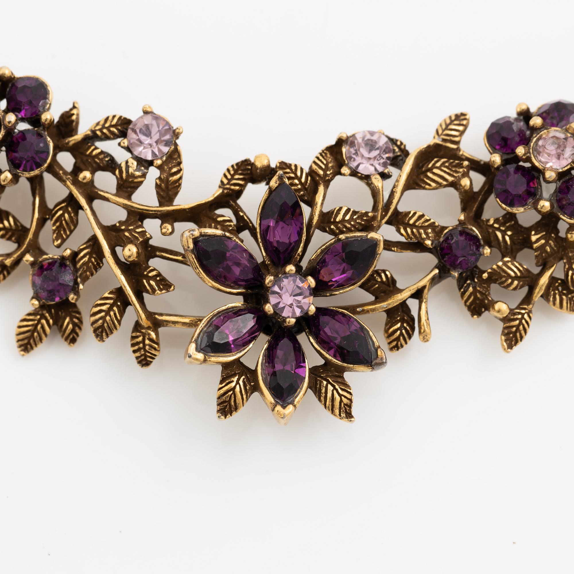 Necklace and brooch with purple stones.