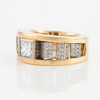 An 18K gold Gaudy ring with a princess-cut diamond.