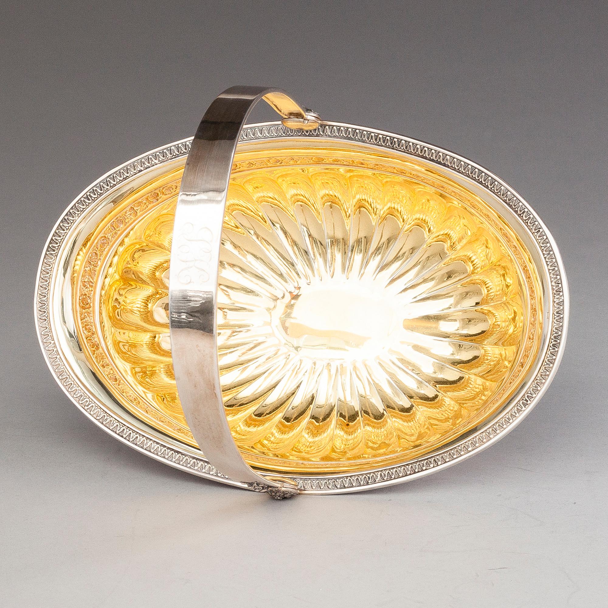 OSKAR LINDROOS, A parcel gilt bread basket, marked OL, Helsinki 1926.