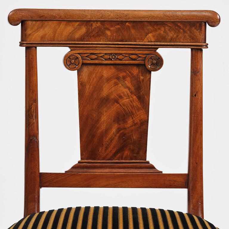 A set of nine Charles X mahogny dining chairs.