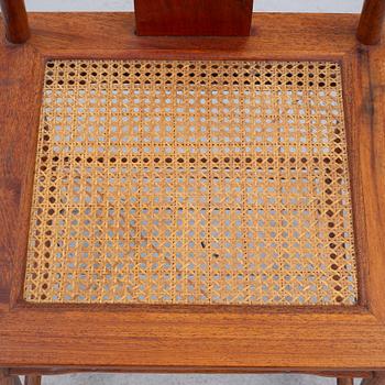 A Chinese hardwood dinner table and ten chairs with rattan seats, 20th century.