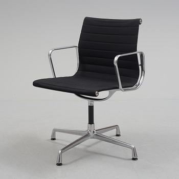 A 'EA 104 Swivel' armchair by Charles & Ray Eames, Vitra, 2016.