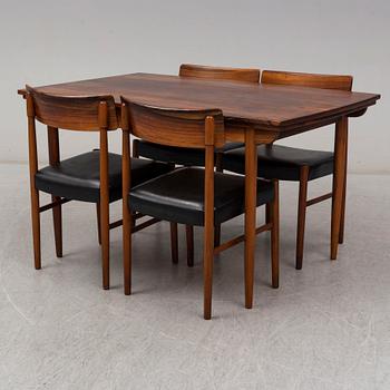 A 1950's/60's rosewood dinner table with four chairs, Denmark.