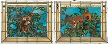 A pair of stained glass windows, circa 1900.