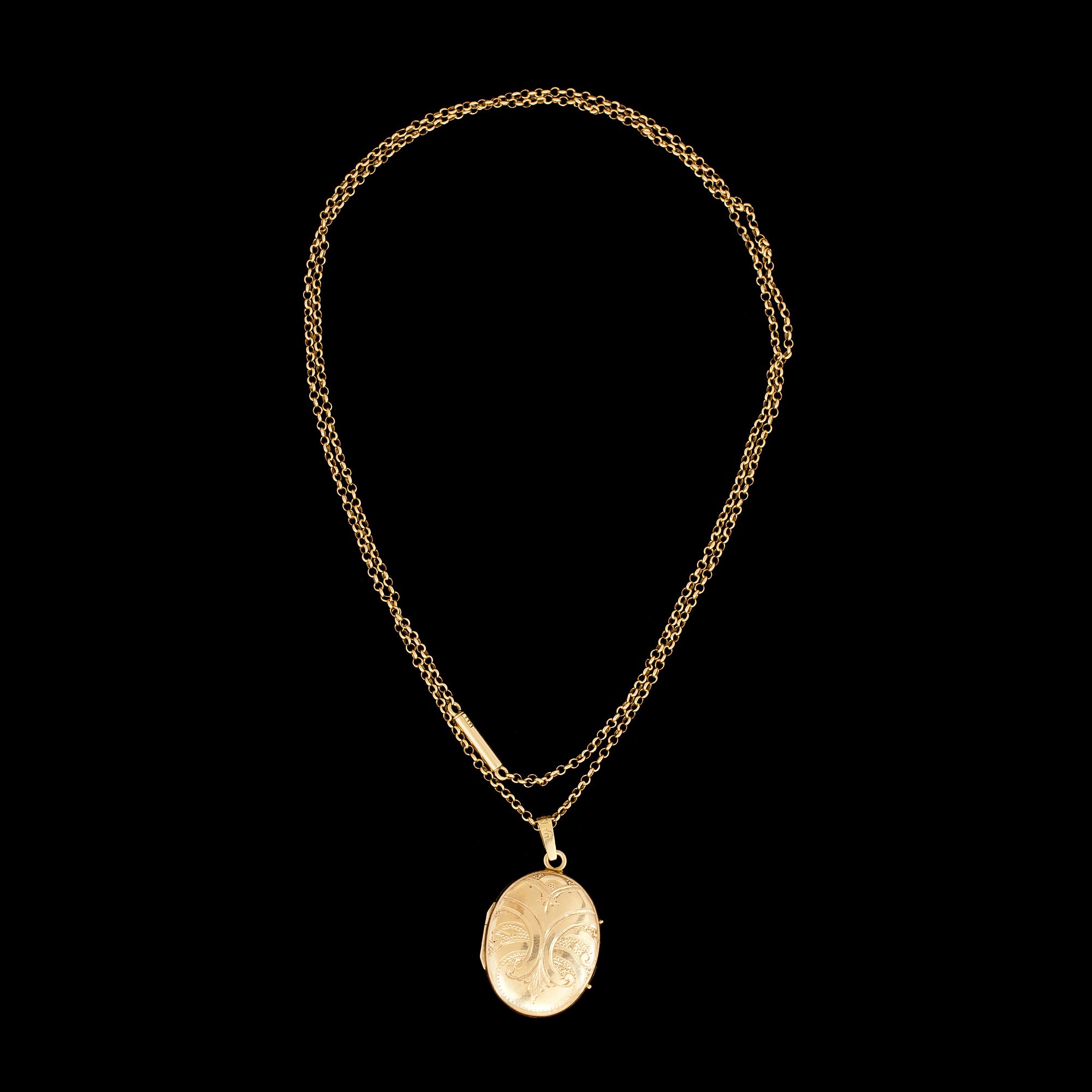 MEDALJONG med KEDJA 18 k guld. Vikt tot 12,8 g.