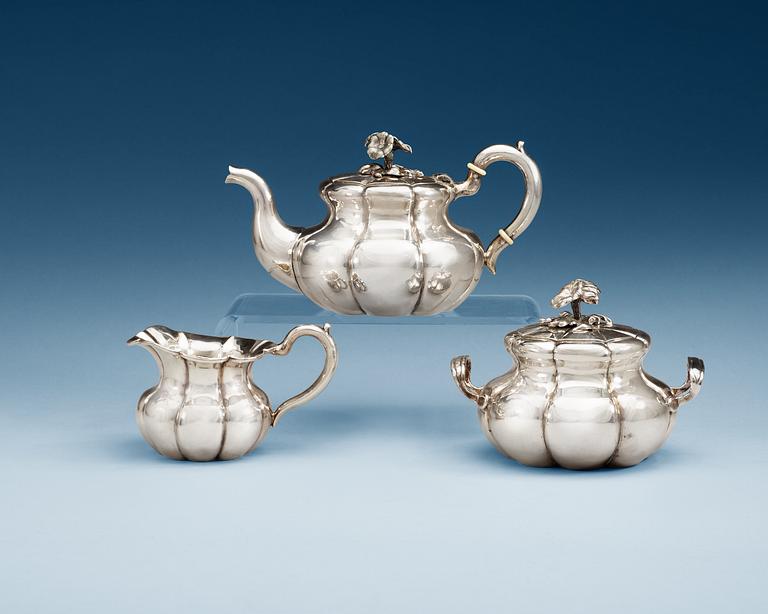 A Russian 19th century parcel-gilt three piece tea-set, makers mark of Carl Siewers, S:t Petersburg 1858.