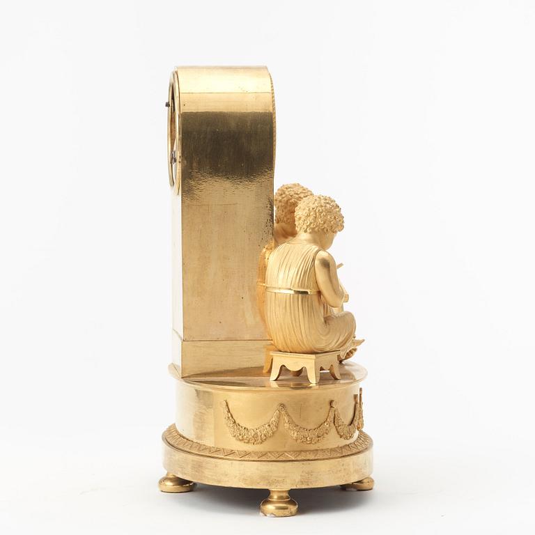 A French Empire early 19th century gilt bronze mantel clock.