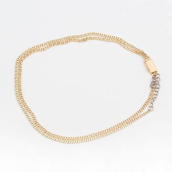 A two-rowed, flattened curb-link necklace.