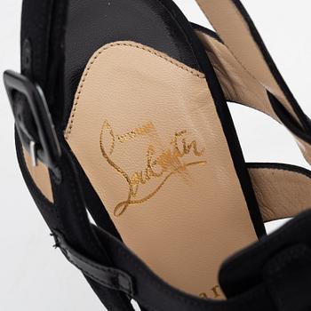 Christian Louboutin, a pair of black silk sandals, size 37 1/2.