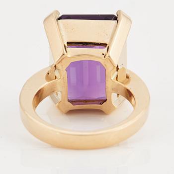 A amethyst and brilliant cut diamond ring.