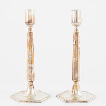 A pair of Swedish silver candlesticks, bearing the mark of K&EC, Gothenburg, 1965.