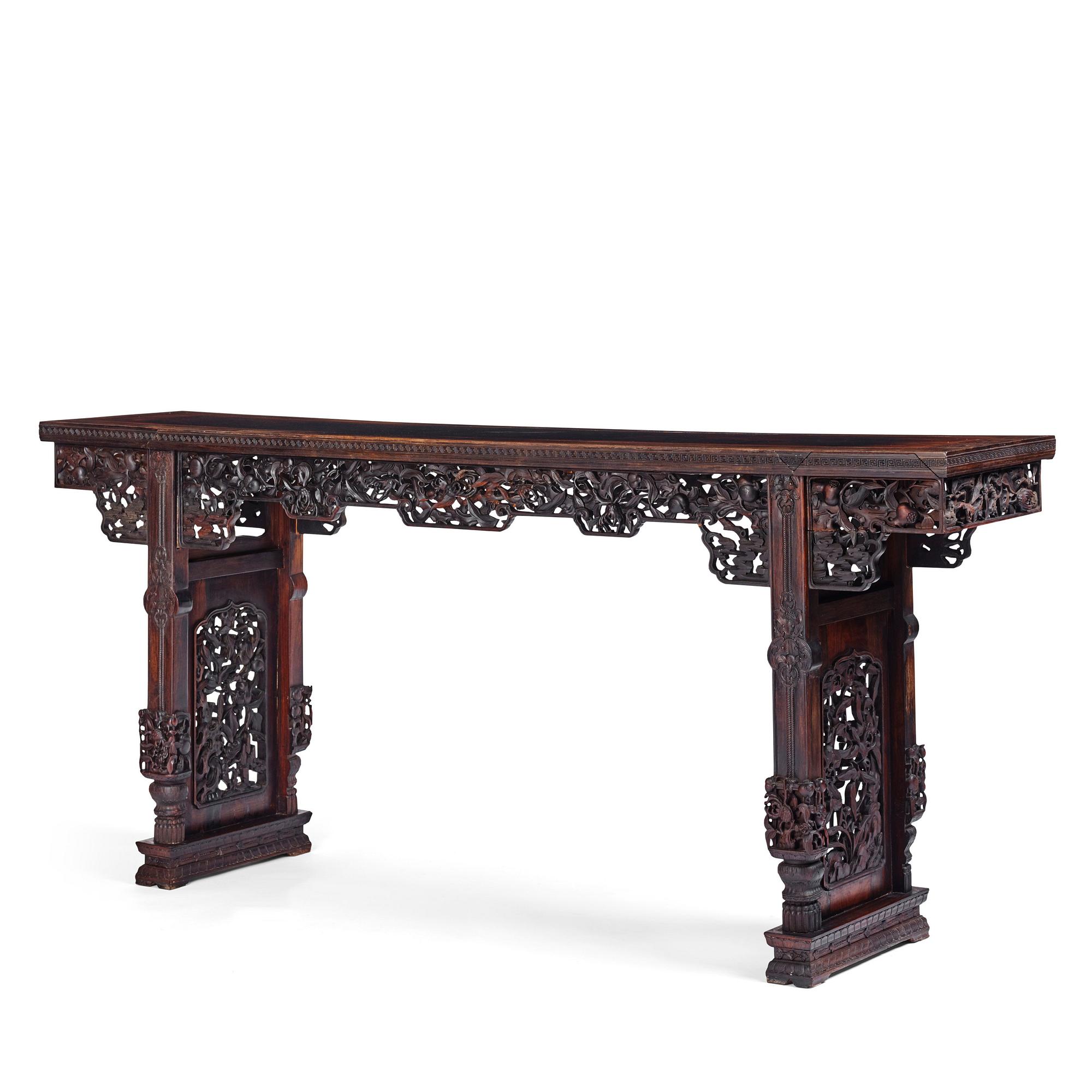 A massive zitan recessed-leg long table 'Jiaotousun Qiotouan', Qing dynasty, 19th century.