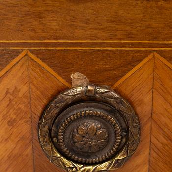 A Louis XVI style chest of drawers, France, circa 1900.