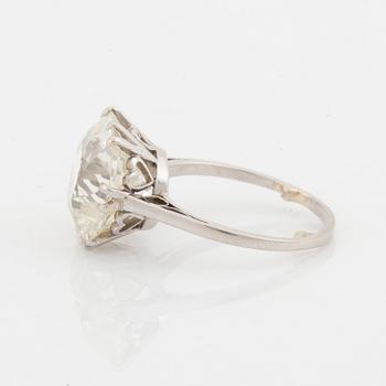 A platinum ring set with a cushion-formed old-cut diamond.