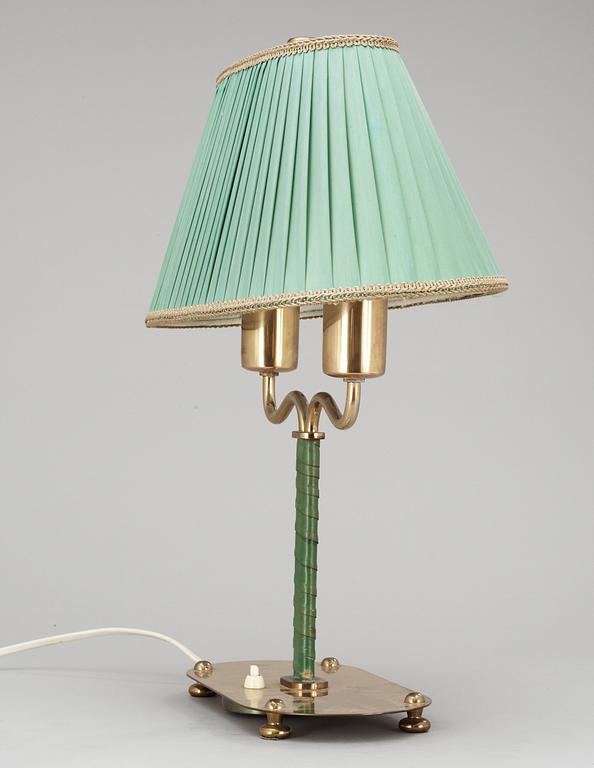 A Josef Frank brass and green leather table lamp, Svenskt Tenn, model 2388.