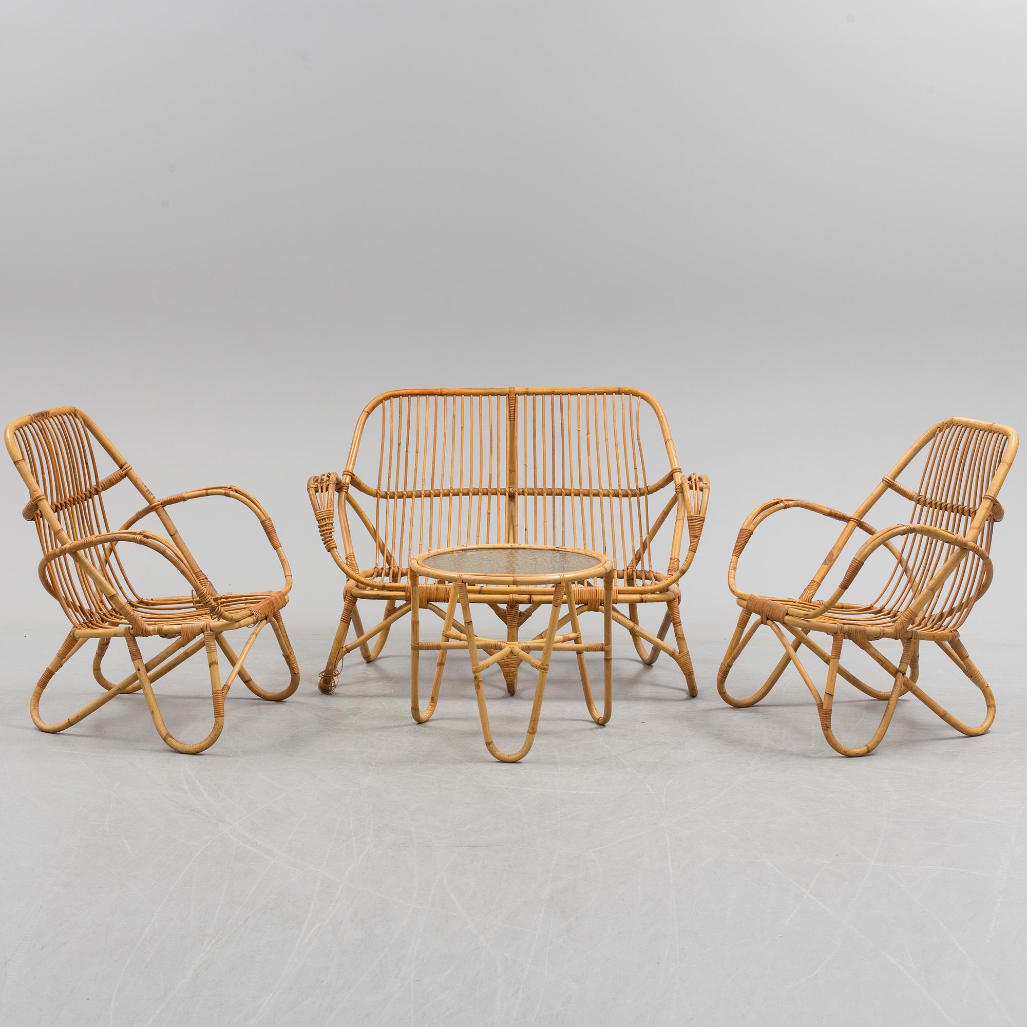 A second half of the 20th century sofa, table and armchairs.