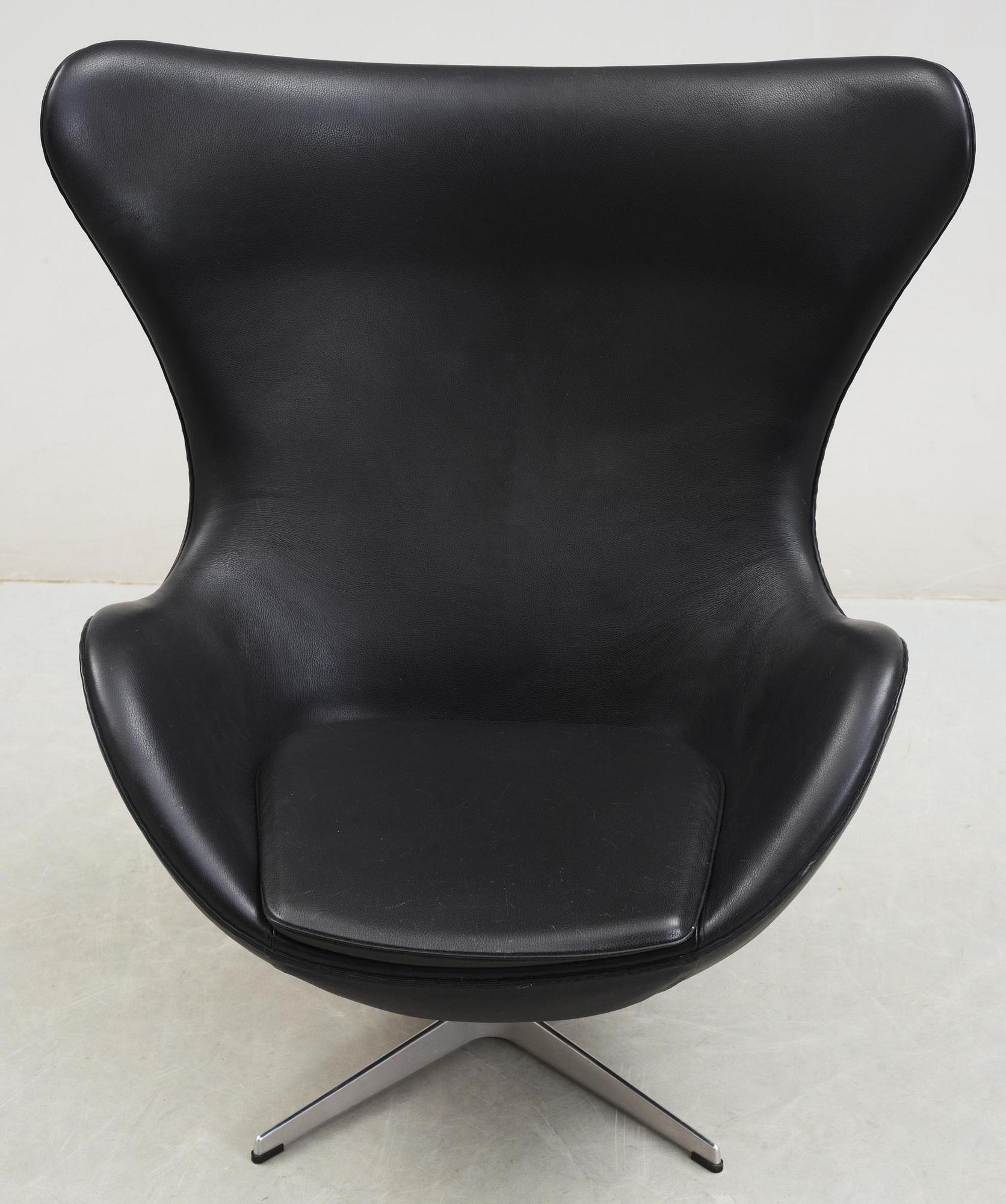 An Arne Jacobsen black leather 'Egg' chair, Fritz Hansen, Denmark 2007.