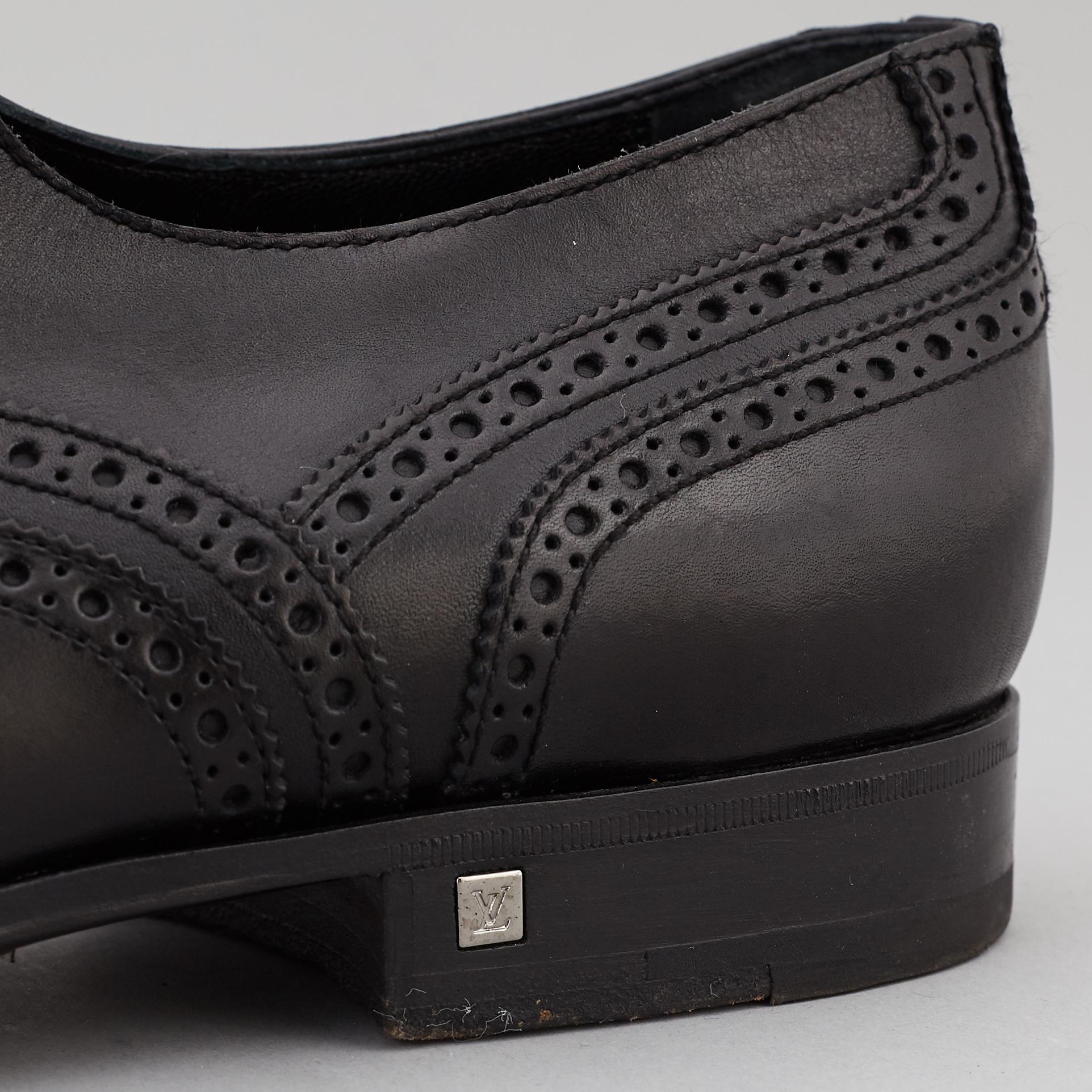 LOUIS VUITTON, a pair of black leather brogues, size 9½.