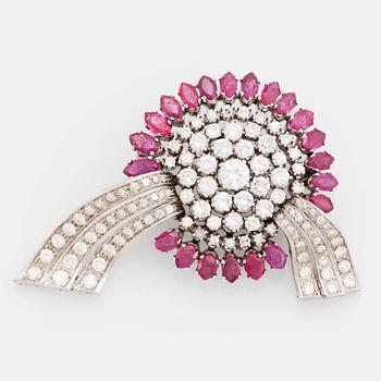 449. An 18K white gold brooch set with round brilliant-cut diamonds and navette-cut rubies.