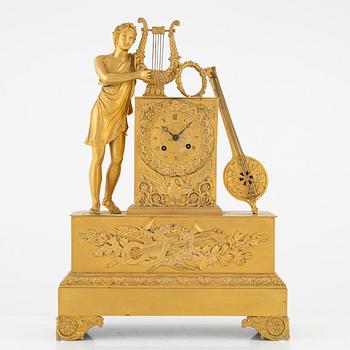 A French Empire ormolu figural mantel clock, early 19th Century.