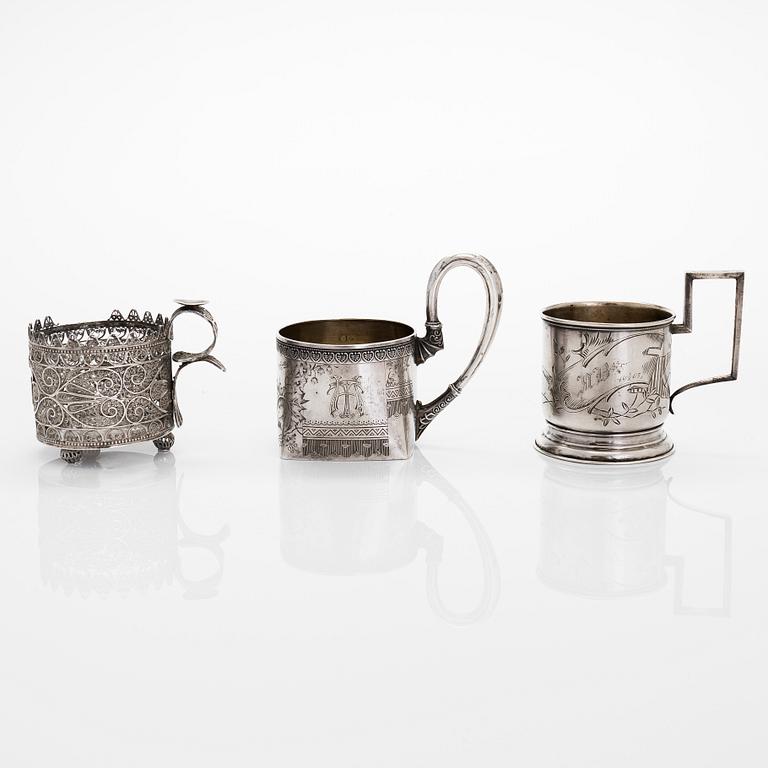 Three silver tea glass holders and four spoons, silver Kostroma and Moscow, late 19th and early 20th centuries.