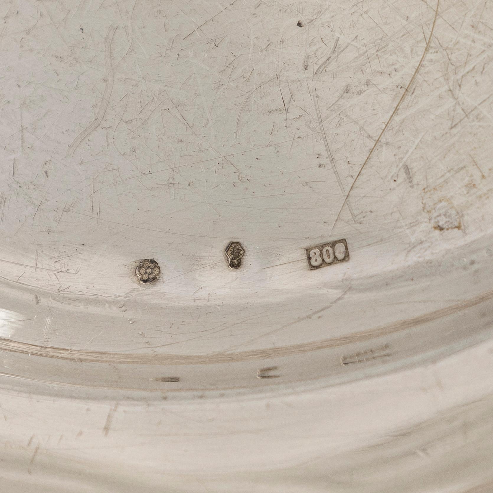 A silver serving platter, and six similar coasters, Austria-Hungary 1867-1922 and Czechoslovakia 1949-1962.