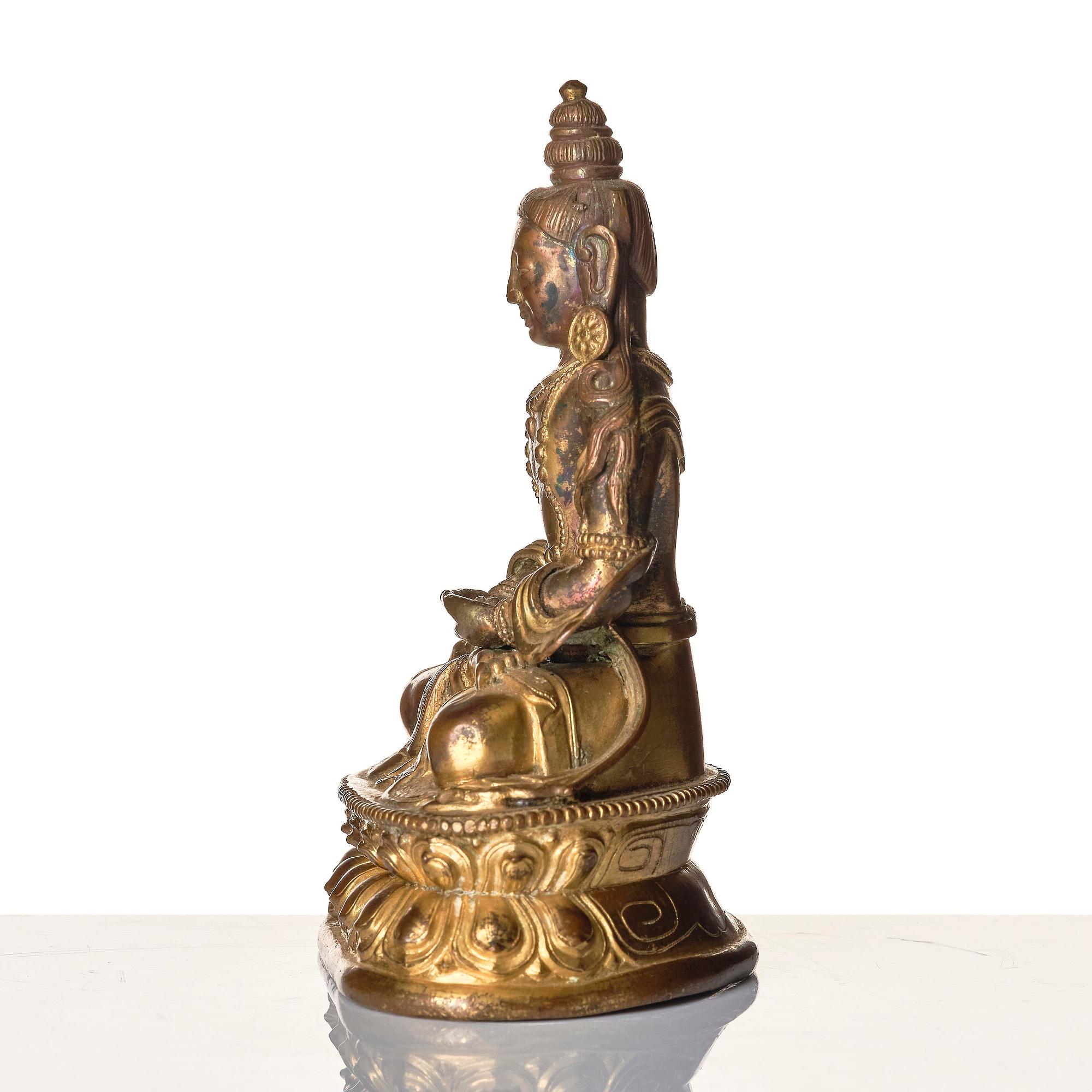 A gilt copper alloy figure of Amitayus, Tibeto-Chinese/Mongolia, 18th century.