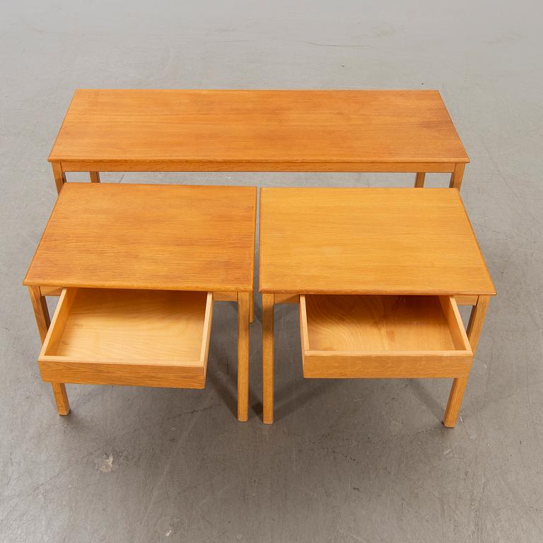 A 1960s oak nesting table.