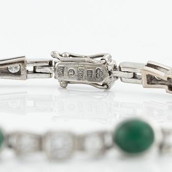 Bracelet, 18K white gold with cabochon-cut emeralds and brilliant-cut diamonds.