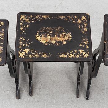 A lacquered nesting table, around 1900.