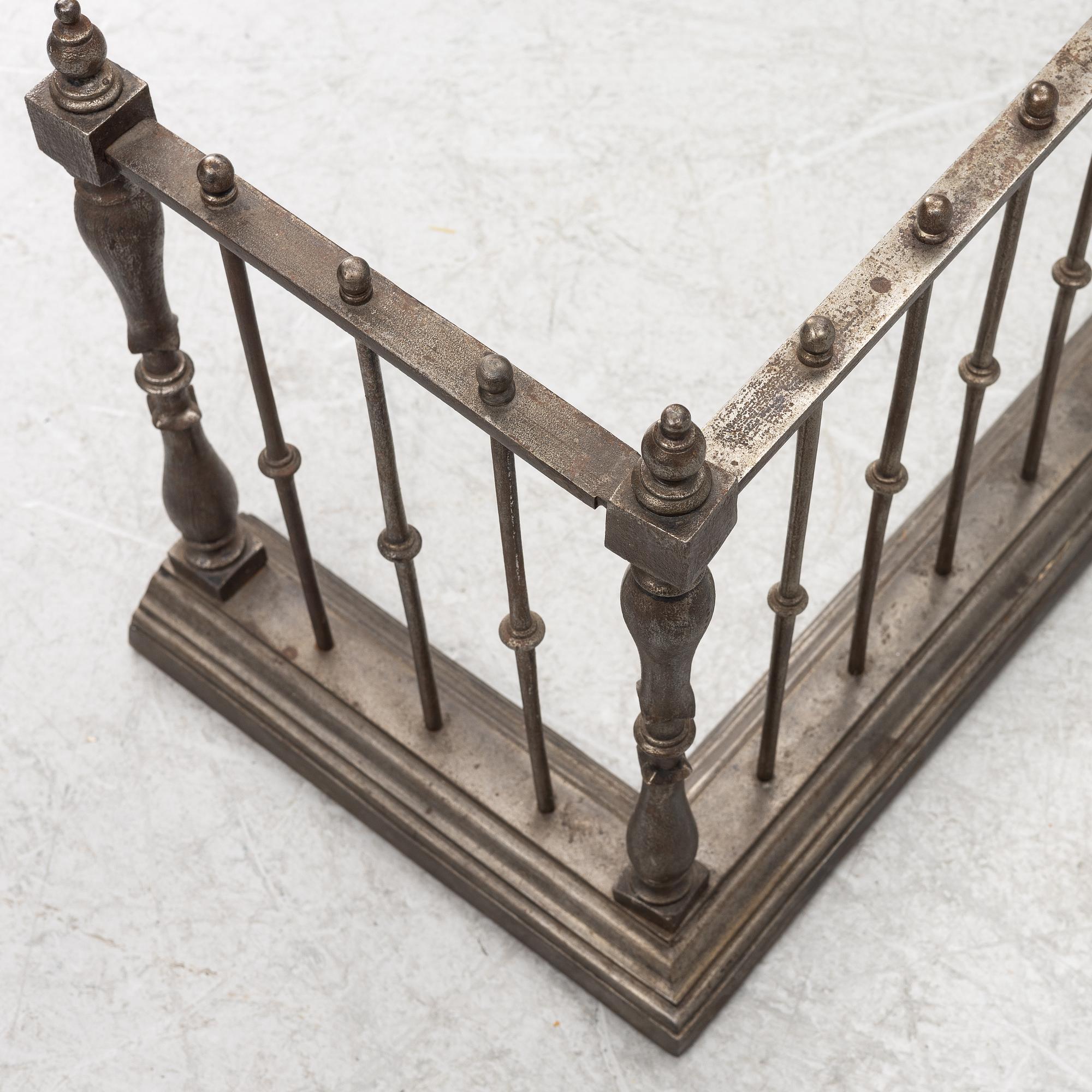 An English brass fire gate, circa 1800.