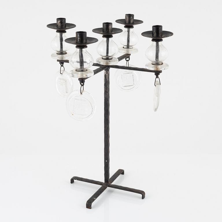 Erik Höglund, a iron and glass candelabra.