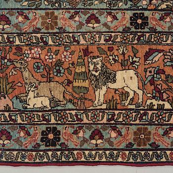 A CARPET, a semi-antique Teheran figural, 303,5 x 198-205,5 cm.