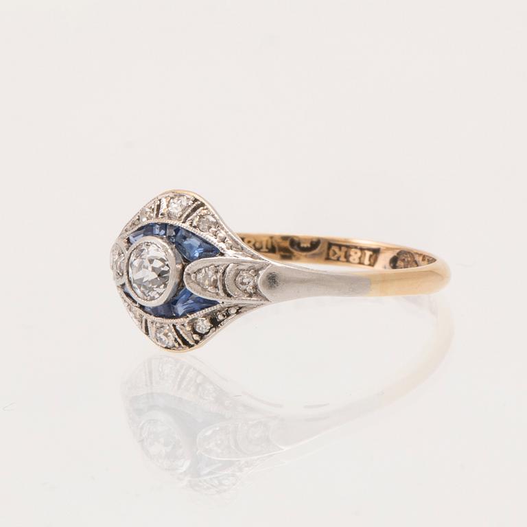 An 18K white and red gold ring set with old-cut diamonds and step-cut blue gemstones, Petterssons Stockholm 1937.