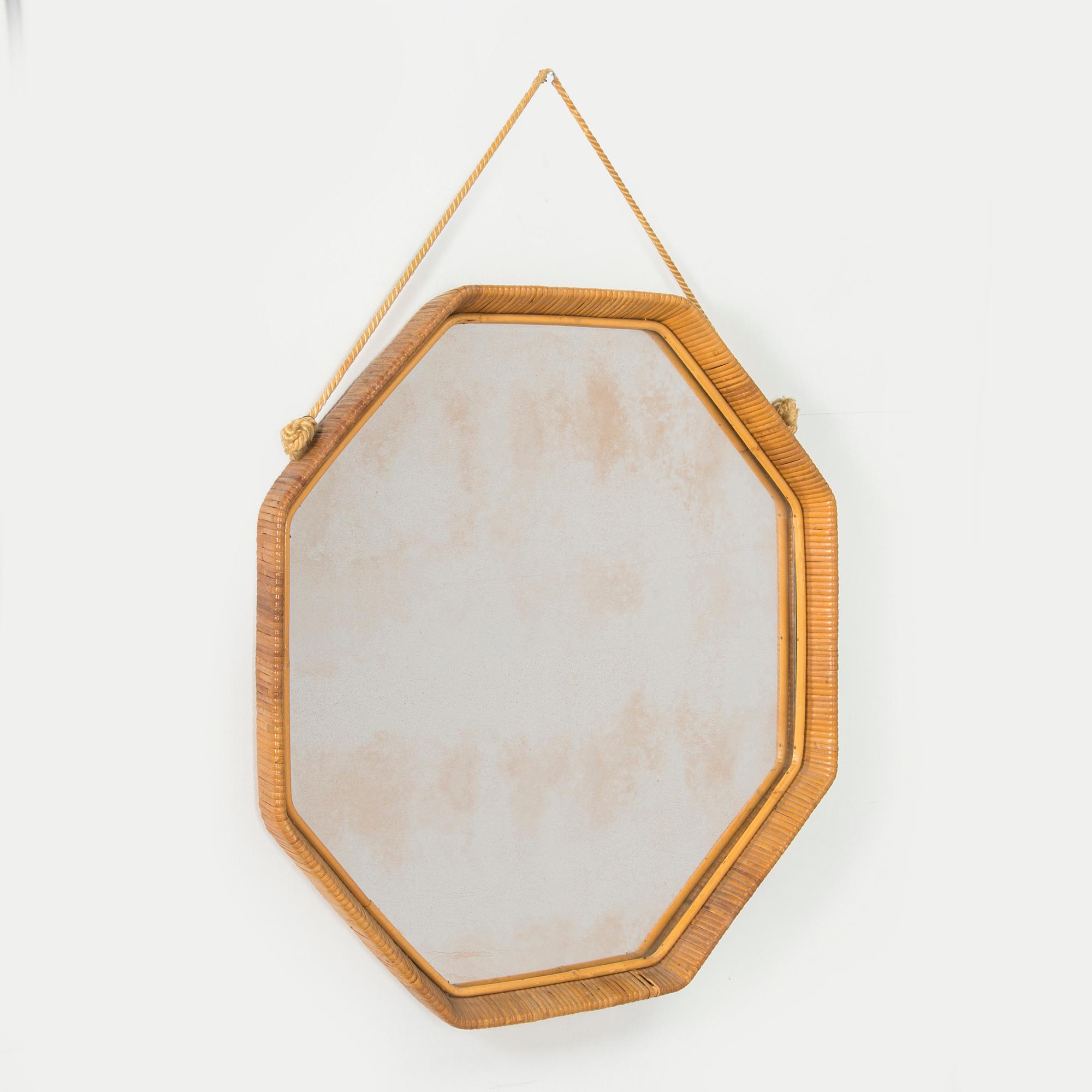 A 1950s rattan mirror.