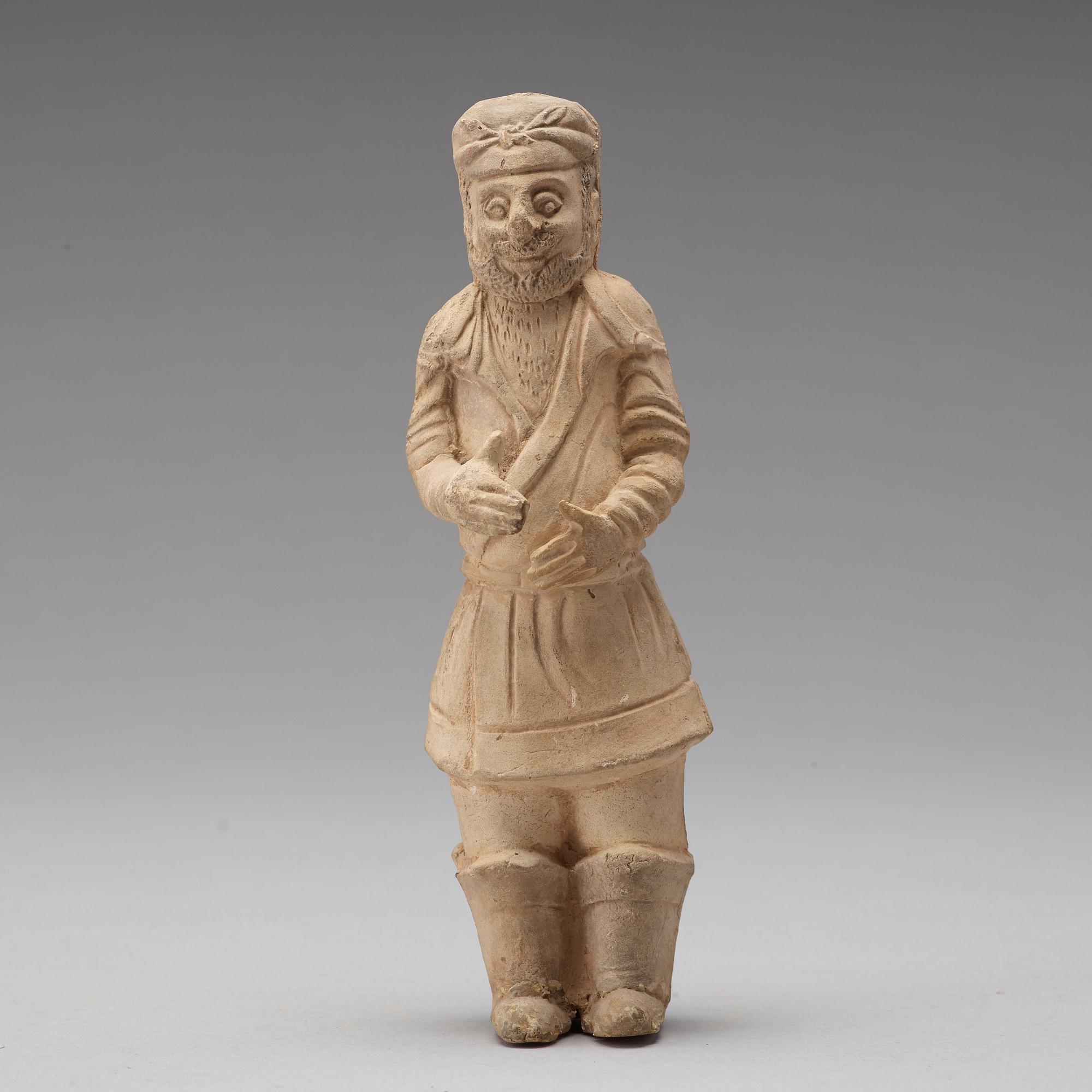 Three pottery scultpures of animals and a herdsman, Tang dynasty (618-906).