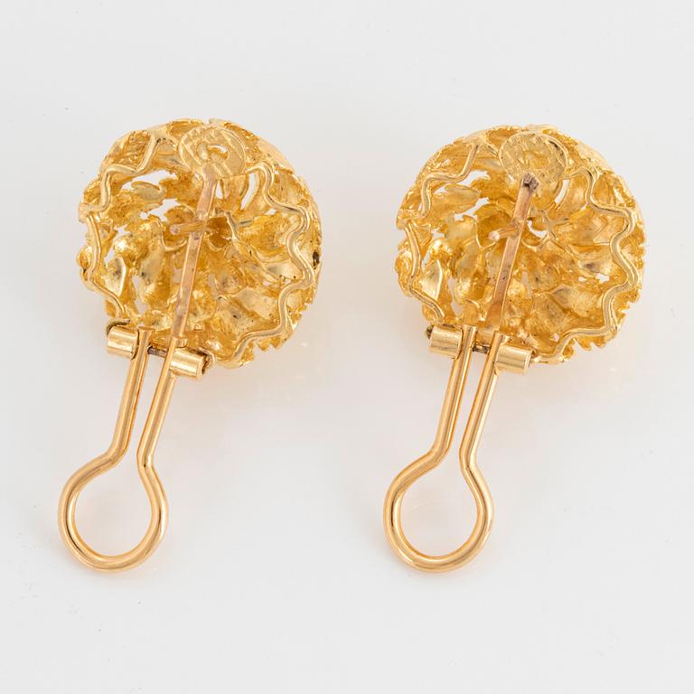 A pair of 18K gold earrings.