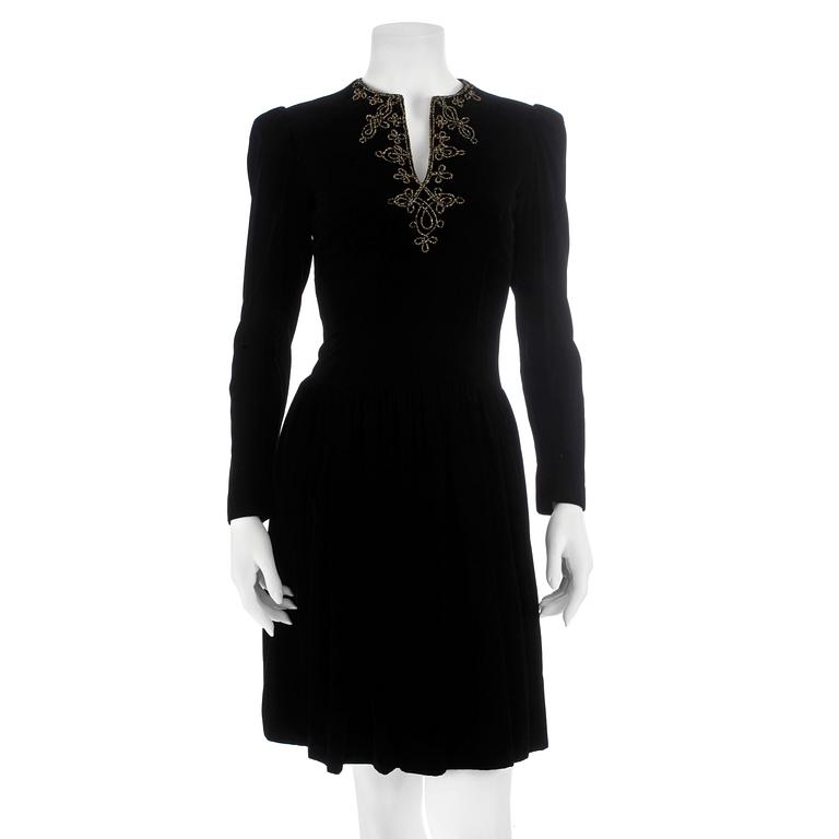 OSCAR DE LA RENTA, a black velvet dress with beading.