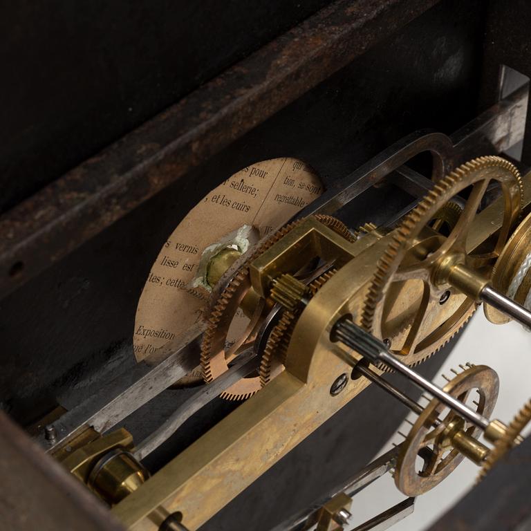 A walnut long case clock, from around the year 1900.
