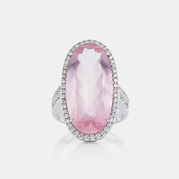 672. A rose quartz, circa 12.00 ct, and brilliant-cut diamond, circa 1.12 ct, ring.