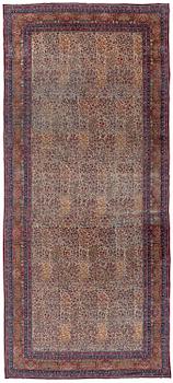 386. An antique 'Millefleur' Kerman Laver carpet, c. 964 x 426 cm.