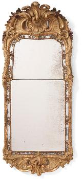 86. A Swedish giltwood and polychrome-painted Rococo mirror, later part of the 18th century.